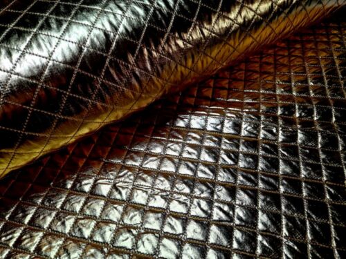 doorgestikte stof goud