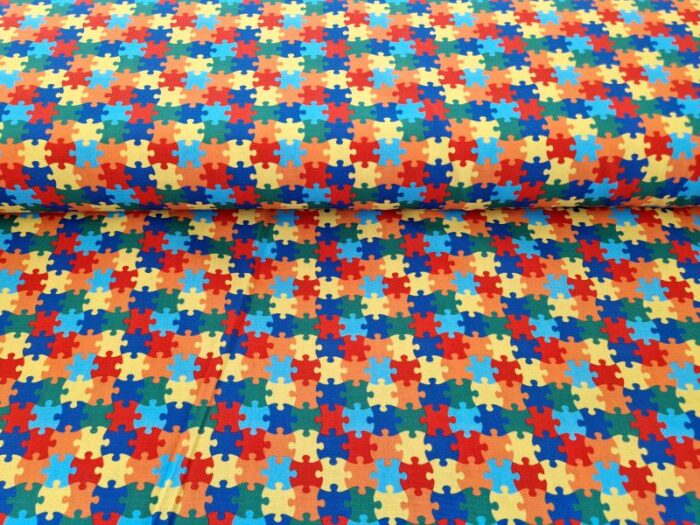 bedrukte katoen stof met puzzelstukjes